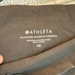 Athleta dark green salutation legging/pants